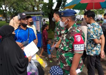 Hujan Guyur Kota Makassar Tidak Mengurung Tim Vaksinator Bekerja